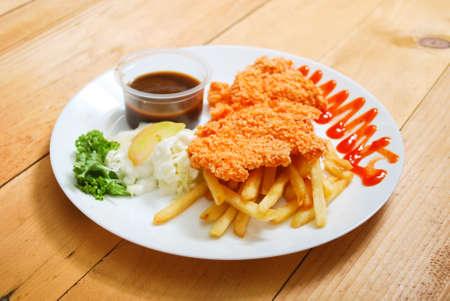 Chicken Chop served on white plate. Western food menu. View from topの写真素材