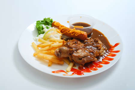 Grilled Chicken served on white plate. Western food menu. View from topの写真素材