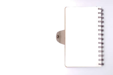 White office desk table with open note book . Top view with copy space, flat lay.の写真素材