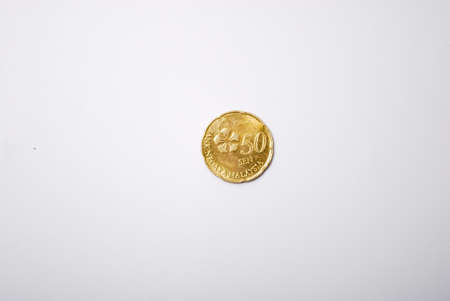 A MYR 50 cent coin isolated with white background. Top view with copy spaceの写真素材