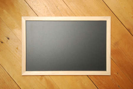 School empty wooden blackboard on wooden floor. Education concept. Back to school theme. Top view...