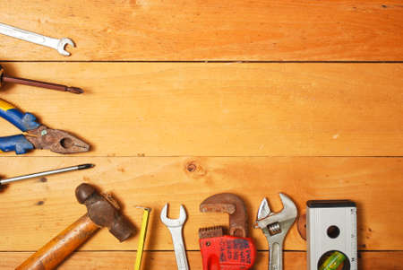 Assorted work and home tools.Wooden background and copy space