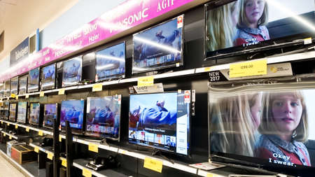MELAKA, MALAYSIA - April 13, 2018 : Assorted brand and type of LED TV on shelf rack display in the...