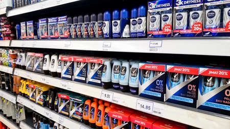 MELAKA, MALAYSIA - April 13, 2018 : Assorted brand and type man and woman care product on shelf rack display in the Tesco store.のeditorial素材