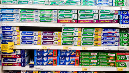 MELAKA, MALAYSIA - April 13, 2018 : Assorted brand of toothpaste on shelf rack display in the store.