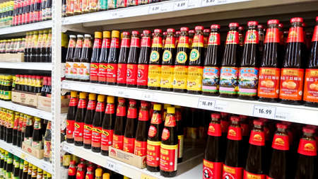 MELAKA, MALAYSIA - April 13, 2018 : Assorted brand and type sauce and ketchup on shelf rack display in the Tesco store.のeditorial素材