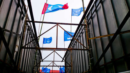 MELAKA, MALAYSIA, April 14, 2018 : The flag of the party contesting in Malaysia's 14th general election. Scenery view is tracked on the roadのeditorial素材