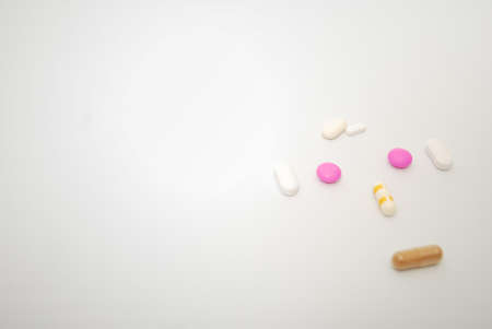 Pills and capsule on white background. Selective focus and copy space