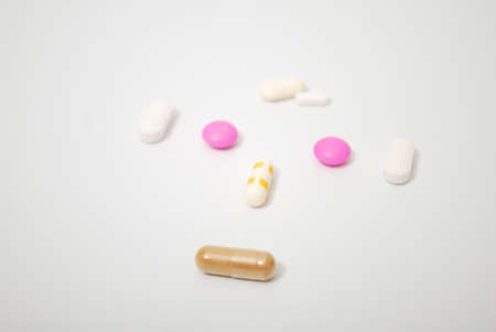 Pills and capsule on white background. Selective focus and copy spaceの写真素材