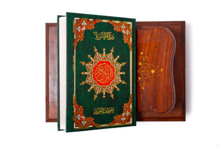 The holy Quran isolated over white background. Muslim holy book and guidanceの写真素材
