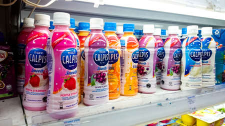 MELAKA, MALAYSIA - May 22, 2018 : A Calpis drink in can display at freezer market. Calpis it the most known soft drink brand in the worldのeditorial素材