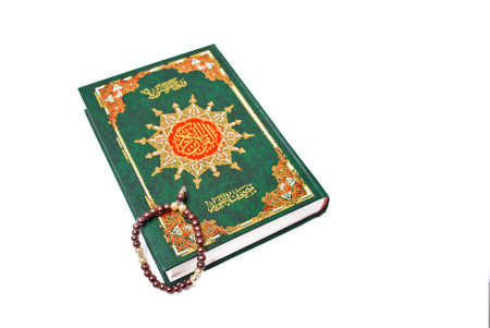The holy Quran isolated over white background. Muslim holy book and guidanceの写真素材