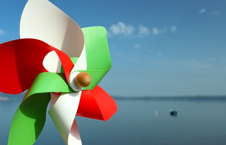 A shot of a pinwheel coloured with italian national flag coloursの写真素材