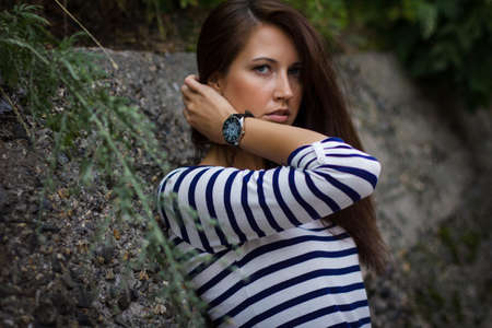 portrait of a cute girl in a t-shirt on the streetの写真素材