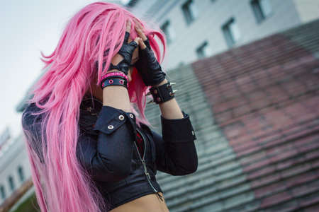 the girl in the wig hides his face