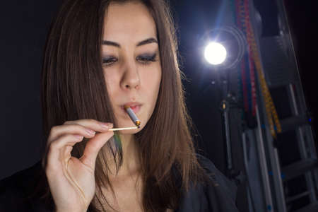 portrait of a girl with a cigaretteの写真素材