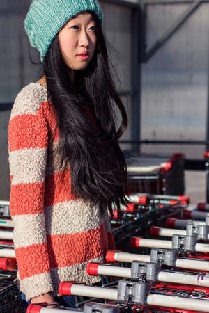 portrait of stylish Asian girls near small cartの写真素材