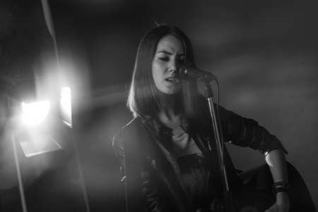 the girl playing guitar in the Studioの写真素材