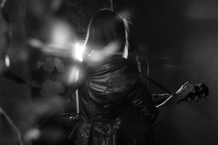the girl playing guitar in the Studioの写真素材