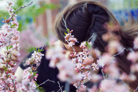 portrait of young beautiful girl in flowers