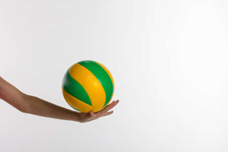 Young sport Girl Holding Volleyball in studioの写真素材