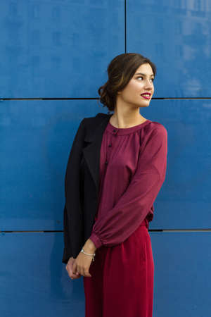 fashion stylish girl in a blouse on the street