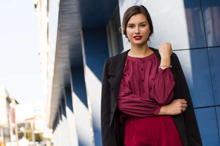 fashion stylish girl in a blouse on the street