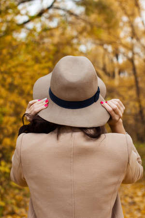 autumn walk girl in the coat in the woodsの写真素材