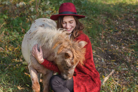 the girl with the horse in autumn in the woodsの写真素材