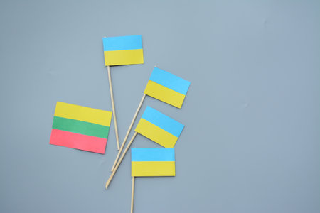 Kids are making small paper flags of Ukraine and Lithuania, Workspace in the kindergartenの写真素材