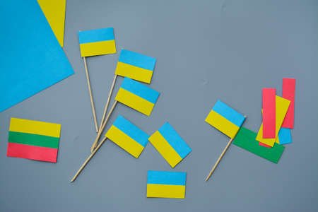 Kids are making small paper flags of Ukraine and Lithuania, Workspace in the kindergartenの写真素材