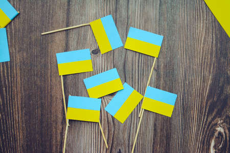 Kids are making small paper flags of Ukraine and Lithuania, Workspace in the kindergartenの写真素材