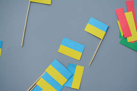 Kids are making small paper flags of Ukraine and Lithuania, Workspace in the kindergartenの写真素材