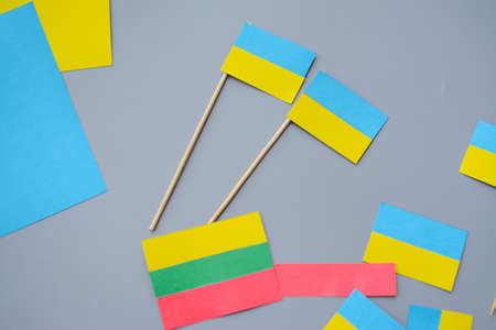Kids are making small paper flags of Ukraine and Lithuania, Workspace in the kindergartenの写真素材