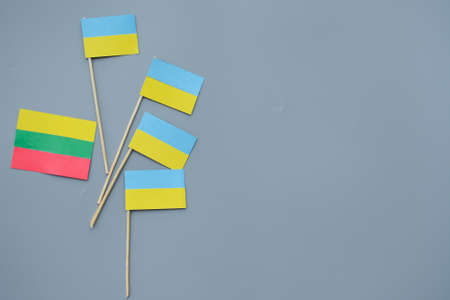 Kids are making small paper flags of Ukraine and Lithuania, Workspace in the kindergartenの写真素材