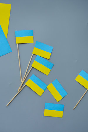Kids are making small paper flags of Ukraine and Lithuania, Workspace in the kindergartenの写真素材