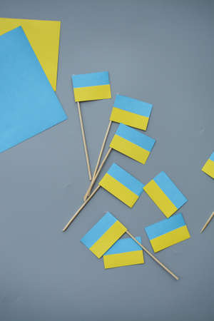 Kids are making small paper flags of Ukraine and Lithuania, Workspace in the kindergartenの写真素材