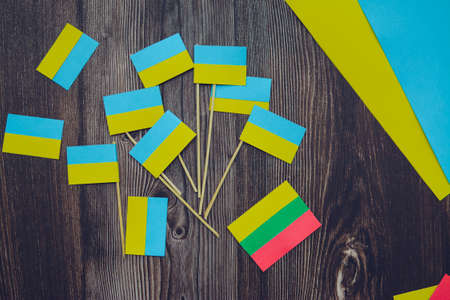 Kids are making small paper flags of Ukraine and Lithuania, Workspace in the kindergartenの写真素材