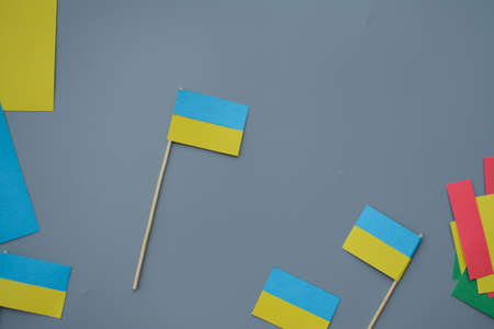 Kids are making small paper flags of Ukraine and Lithuania, Workspace in the kindergartenの写真素材