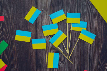 Kids are making small paper flags of Ukraine and Lithuania, Workspace in the kindergartenの写真素材
