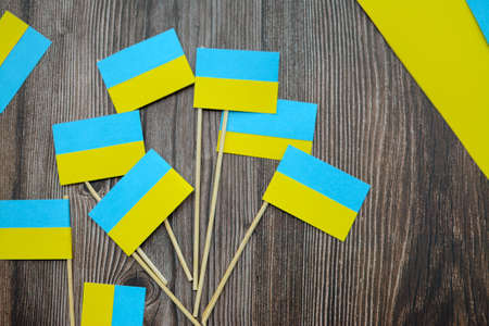 Kids are making small paper flags of Ukraine and Lithuania, Workspace in the kindergartenの写真素材