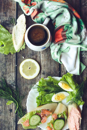 Salmon sandwich and coffee for breakfastの写真素材