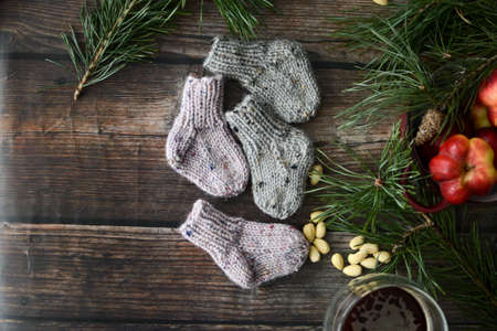 Small chunky and warm baby socks, made of woolen yarnの写真素材