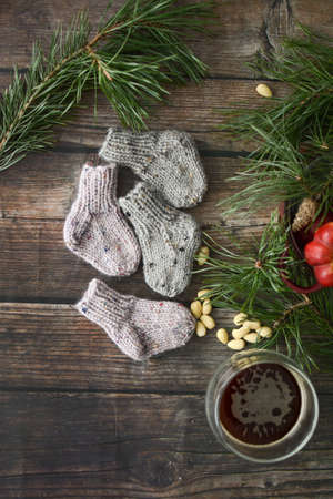 Small chunky and warm baby socks, made of woolen yarnの写真素材