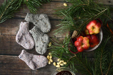 Small chunky and warm baby socks, made of woolen yarnの写真素材
