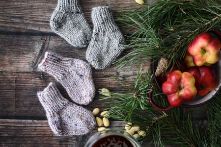 Small chunky and warm baby socks, made of woolen yarnの写真素材