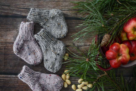 Small chunky and warm baby socks, made of woolen yarnの写真素材