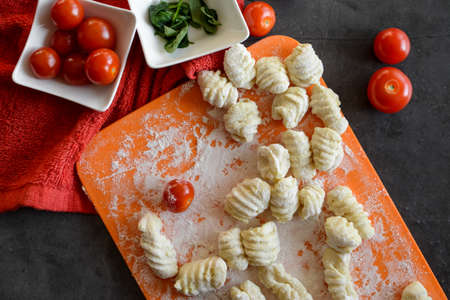 Making Italian gnocchi for breakfast, cooking process in the kitchen
