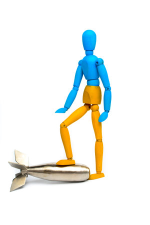 Wooden doll of Ukrainian flag colors, on gray backgroundの写真素材
