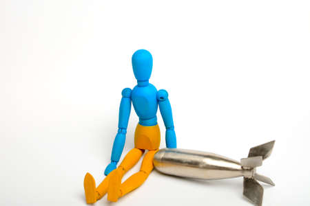 Wooden doll of Ukrainian flag colors, on gray backgroundの写真素材